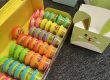 A large pack of Play-Doh cans next to empty bunny cardboard Easter Baskets.